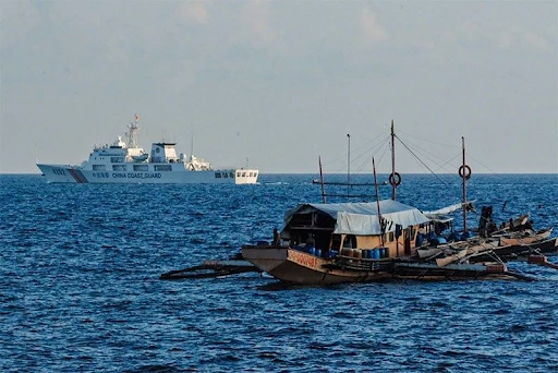 Members of the Chinese Coast Guard (CGG) were seen roving around the Rozul Reef in Palawan as they patrol the area on April 21, 2024 | STAR / Ryan Baldemor